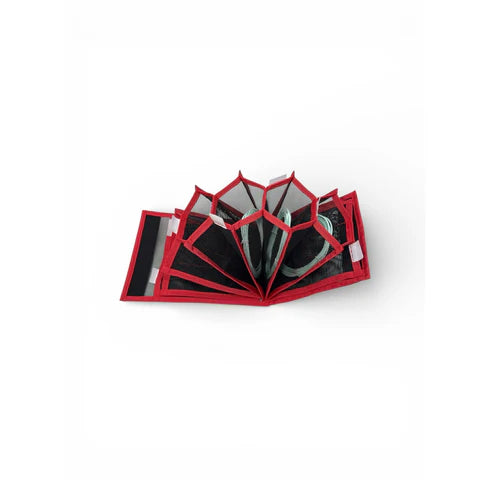 Black mesh pouch with red trim and OPST logo showing compartments 