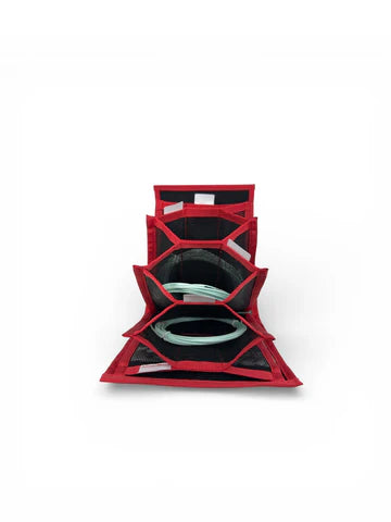 A red and black multi-compartment organizer or storage case, shown open to reveal circular compartments containing OPST Commando Heads as a sample