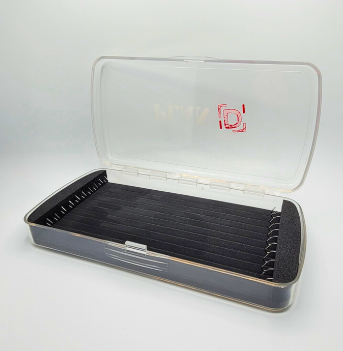 Clear fishing lure box with black interior on a white background